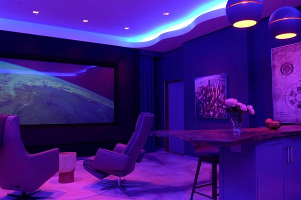 Sonance home theater with purple and blue lights