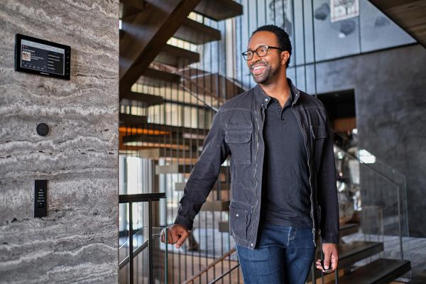 Josh.Ai in a wall and a man walking in