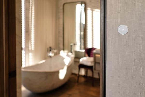 Josh.AI outside a bathroom wall