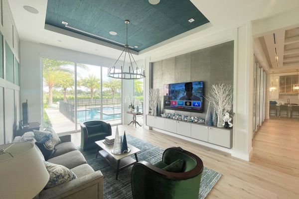 Living Room overlooking outdoor pool with a TV