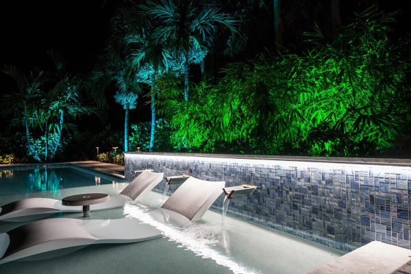 Palm beach outdoor pool with lighting design at night