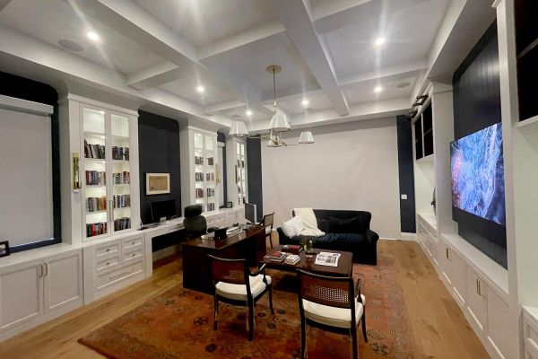 Home Office with TV hanging in the wall