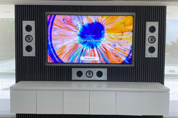 TV in a wall with a 3 open speaker setup