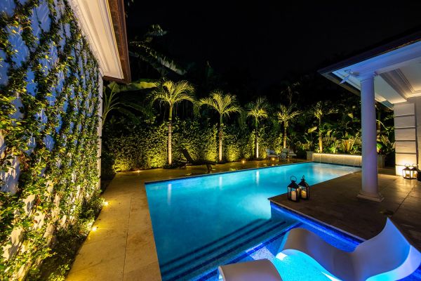 Palm beach outdoor pool with lighting design at night